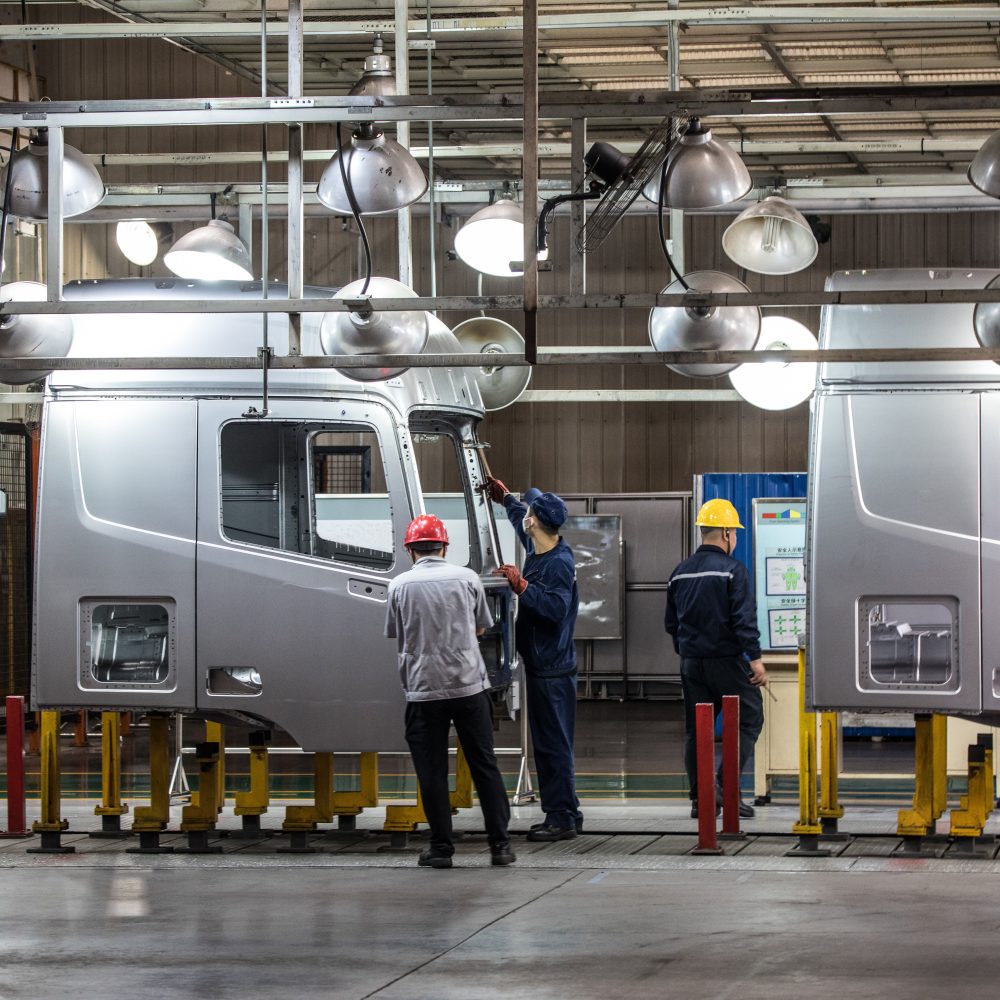 Workers in machinery factory in China.